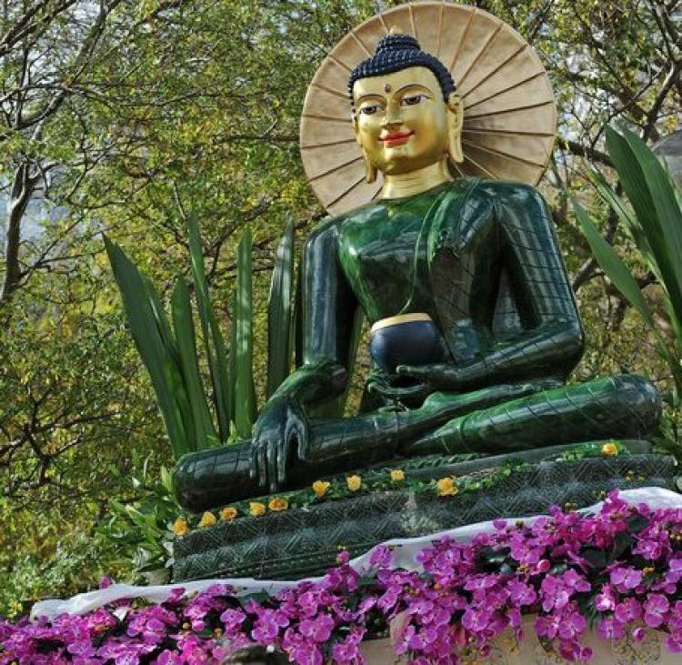 The Jade Buddha for Universal Peace, displayed here in Sydney in 2009, is the largest Buddha figure carved from gemstone quality nephrite jade. The statue was carved from a rare 18-tonne boulder discovered at the Polar Jade mine in northwestern B.C. (Greg Wood/AFP/Getty Images)