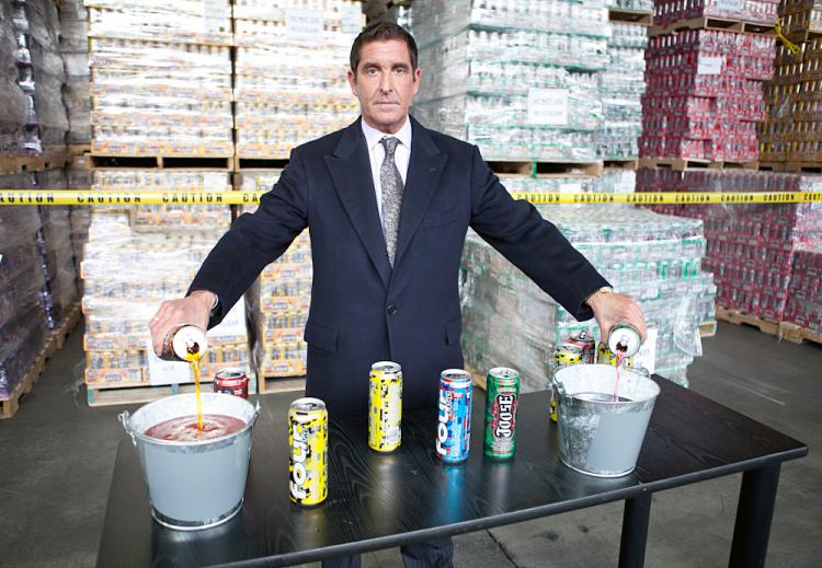 State Sen. Jeffrey Klein announced the destruction of $350,000 worth of banned caffeinated alcoholic beverages and disposed the first few cans himself at a Bronx beer distributor warehouse on Wednesday.   (The Epoch Times)