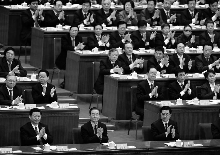 China's top leaders, including President Hu Jintao (front/R), Premier Wen Jiabao (front/C) and Vice President Xi Jingping (front/L) applaud at the closing session of the Chinese People's Political Consultative Conference in Beijing on March 13, 2010. (Frederic J. Brown/AFP/Getty Images)