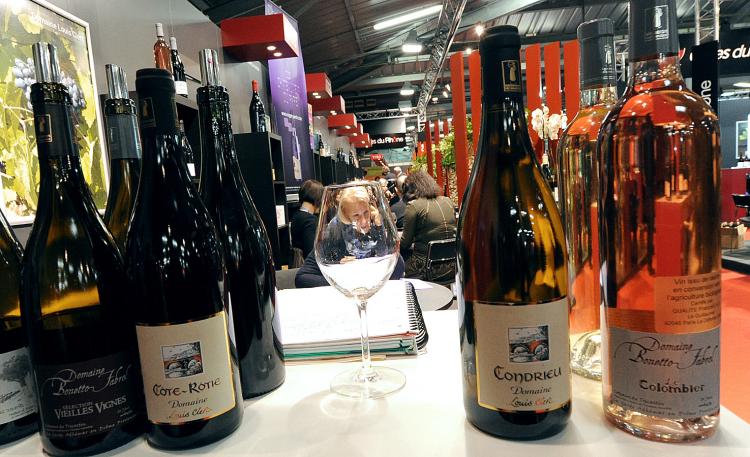 A visitor is pictured through a glass of wine at a stand on February 23, 2010 in Montpellier, southern France, at an international exhibition of Mediterranean wines and spirits. Europe wants to expand its market into South America in a free trade deal. (Gerard Julien/AFP/Getty Images)