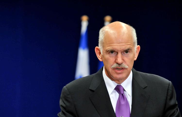 TIME TO SUE: Greek Prime Minister George A. Papandreou gives a press conference at the  European Union summit at the European Council headquarters on May 7 in Brussels. Papandreou announced Greece might sue the U.S. banks.  (Georges Gobet/AFP/Getty Images )