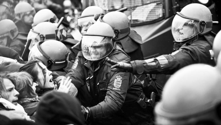 Climate summit protesters attempted to break through barricades, leading to clashes with the police. Dozens have been arrested. (Adrian Dennis/AFP/Getty Images)