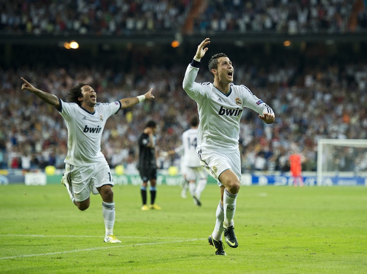 Real Madrid's Cristiano Ronaldo (R) celebrates his game-winning goal against Manchester City in Champions League play in Madrid on Tuesday, September 18, 2012. (Jasper Juinen/Getty Images) 