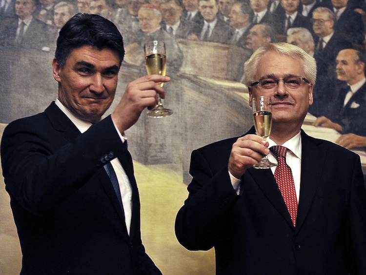 Croatian President Ivo Josipovic (R) and Prime Minister Zoran Milanovic toast