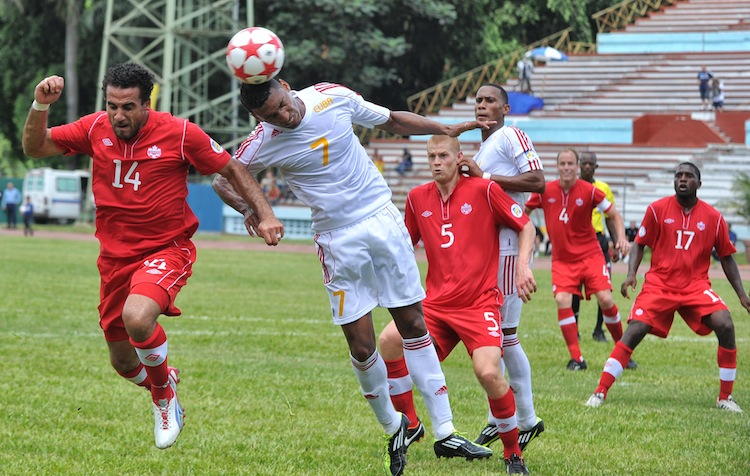 Canada's Dwayne De Rosario (L) and Cuba's Marcel Hernandez compete for the ball in World Cup qualifying play in Havana, Cuba, last Friday.  (Adalberto Roque/AFP/GettyImages) 