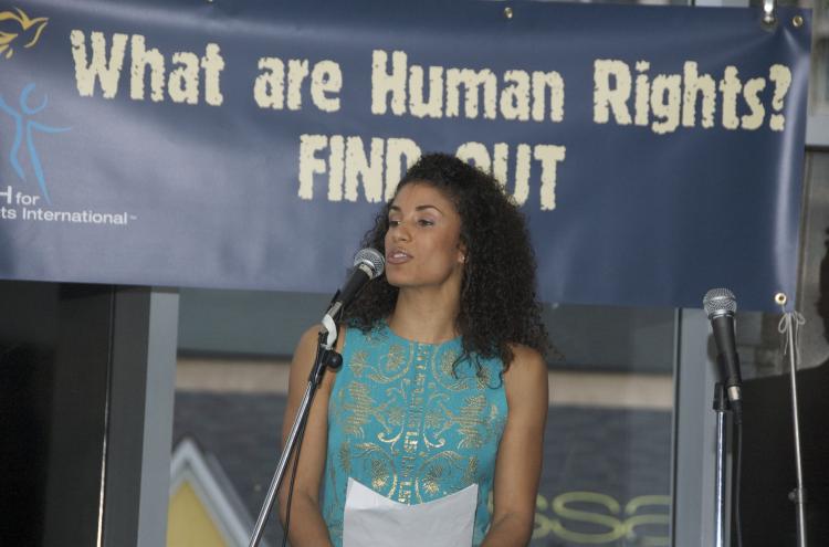 Host Carla Magna introduces the event in support of the 60th Anniversary of the Universal Declaration of Human Rights.  (Diana Hubert/Epoch Times)