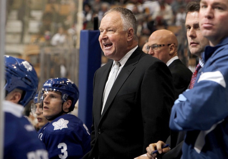 Toronto Maple Leafs head coach Randy Carlyle tasted his first defeat with his new team on Tuesday against the Stanley Cup champion Boston Bruins. His Leafs then lost on Wednesday in Pittsburgh. He had won his first game last Saturday night against the Montreal Canadiens. (Abelimages/Getty Images)