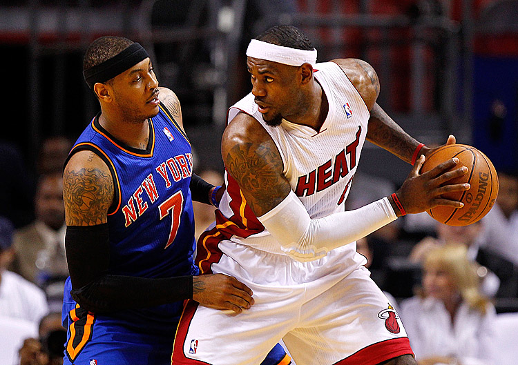 Carmelo Anthony (L) scored 30 points but it wasn't enough as LeBron James (R) and the Heat turned up their defense in the second half. (Mike Ehrmann/Getty Images)