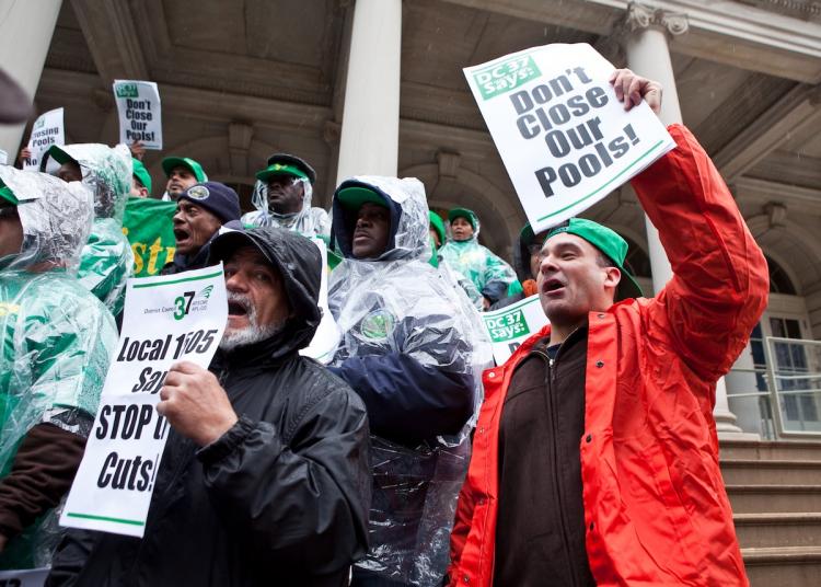PARKS' BUDGET CUT: Park workers joined city officials, union leaders, and community advocates outside City Hall on Thursday to denounce proposed budget cuts to the city's Parks Department. The hardest-hit area is personnel. (Amal Chen/The Epoch Times)