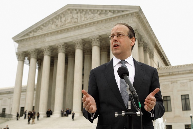 Paul Clement, the attorney representing the 26 states challenging the Patient Protection and Affordable Care Act, talks to the news media outside the U.S. Supreme Court on the third day of oral arguments over the constitutionality of the act, March 28 in Washington, D.C. Wednesday was the last of three days the high court set to hear arguments over the act. (Chip Somodevilla/Getty Images) 