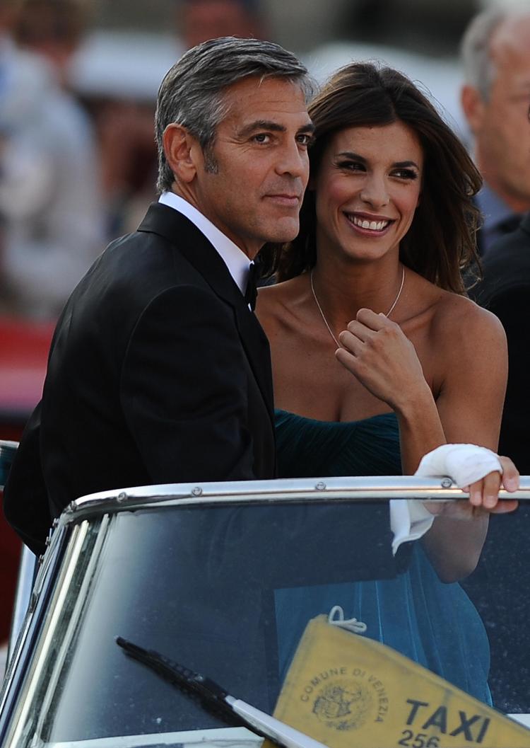 NEW GAL: US actor George Clooney (L) and girlfriend Elisabetta Canalis arrive on a boat for the screening of The Men Who Stare at Goats at the Venice film festival on September 8, 2009. (FILIPPO MONTEFORTE/AFP/Getty Images)