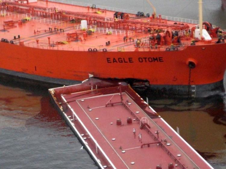 A collision between the towing vessel Dixie Vengeance and the two barges it was pushing, and the 807-foot tank ship Eagle Otome in Port Arthur, Texas, on Saturday.  (U.S. Coast Guard photo)