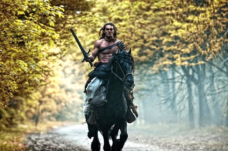 RIDING: Jason Momoa in a scene from the fantasy-adventure film 'Conan the Barbarian.'  (Simon Varsano/Lionsgate Publicity)
