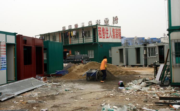 The sign reads 'Cargo Shipping Container House for Rent/Purchase' (The Epoch Times Archives)