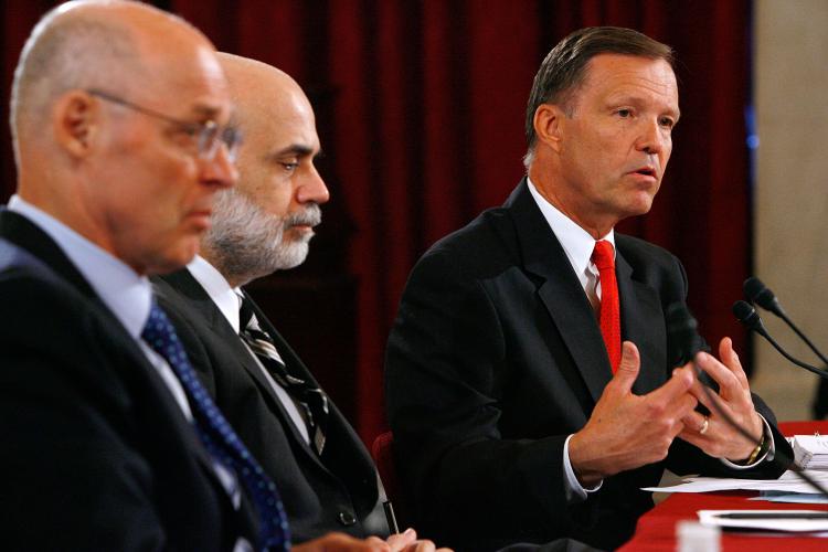 SEC Chairman Christopher Cox (R) testifies before the Senate Banking, Housing and Urban Affairs Committee on July 15 as Treasury Secretary Henry Paulson (L) and Federal Reserve Chairman Ben Bernanke (C) look on. (Chip Somodevilla/Getty Images)