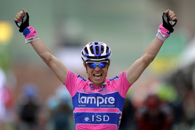 TAKES THE YELLOW: Damiano Cunego won the race leader's yellow jersey with an incredible uphill attack in Stage Three. If he could have descended as well as he climbed he would have won the stage as well. (Fabrice Coffrini/Getty Images )