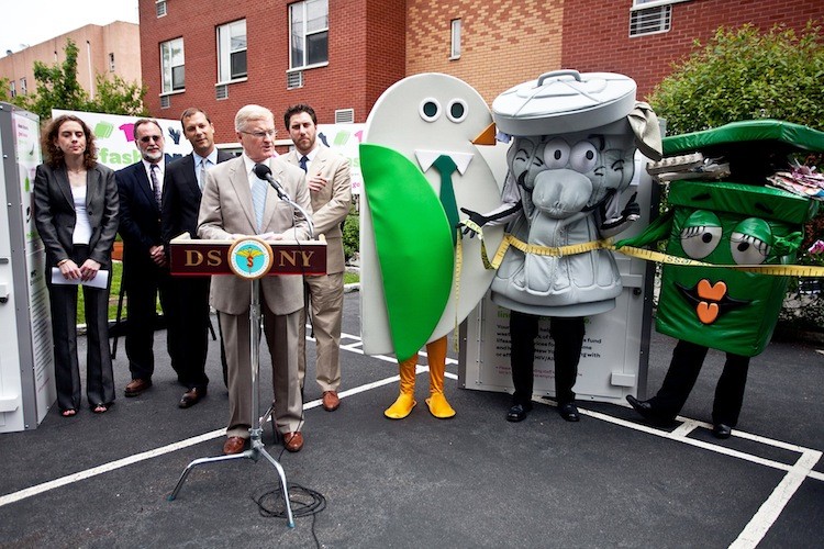 TEXTILE RECYCLING: Department of Sanitation Commissioner John Doherty (at microphone) with other officials and a few costumed characters introduced a new textile-recycling program on Tuesday that includes installing donation bins in large apartment buildings.  (Amal Chen/The Epoch Times)