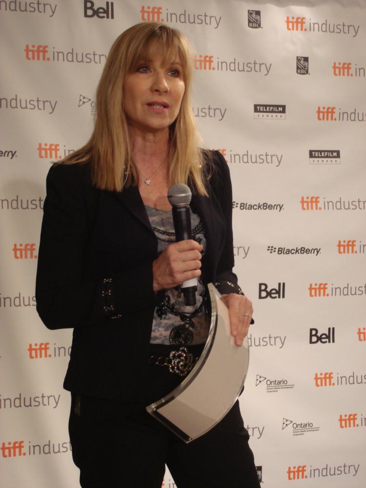 Denise Robert, Quebecois film director of a recent feature movie 'Route 132' accepted the prize and awarded it to a colleague filmmaker Louis Belanger. (Toronto International Film Festival)