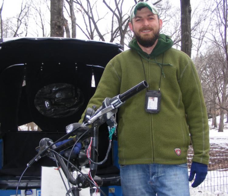 RICKSHAW TAXIMAN: Baristun Cer, 28 years old, came to New York to study International Business at La Guardia College and currently supports himself by operating a pedicab. (Gidon Belmaker/The Epoch Times)