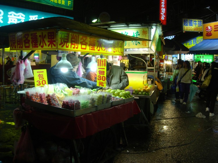 SPECIAL TREAT: Shopping at night markets is a joyful and satisfying adventure for both the eyes and taste buds. (Arnaud Camu/The Epoch Times)