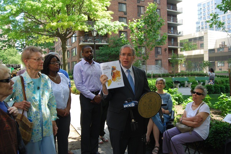 BETTER BOILERS NEEDED: Manhattan Borough President Scott Stringer holds up a map showing the locations of 'dirty' boilers in the city while presenting his plan on Monday, outside Park West Village in the Upper West Side of Manhattan. (Catherine Yang/The Epoch Times)