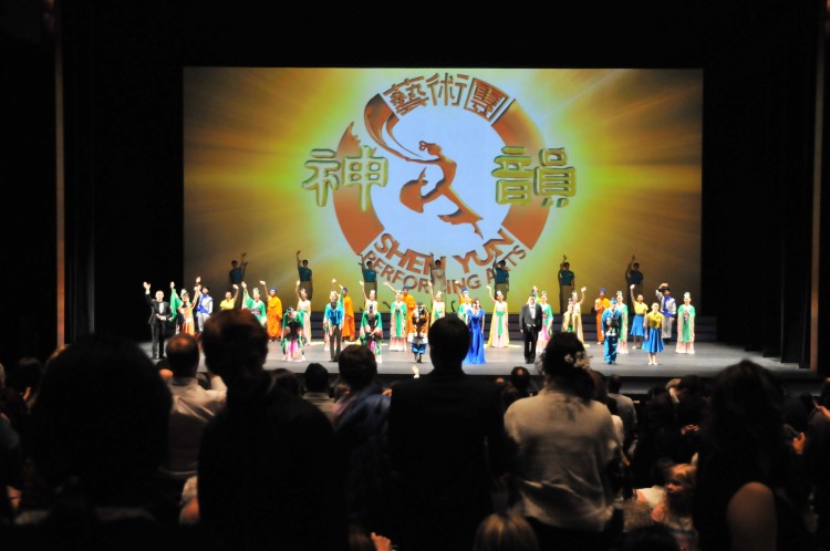 Audience members give a curtain-call standing ovation to Shen Yun performers