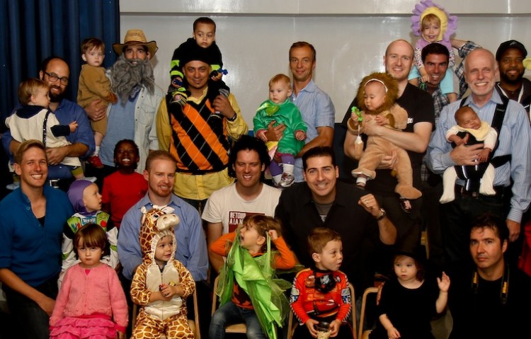 Fathers and children from the New York City dads meetup pose for a picture during a Halloween party in a playroom in downtown Manhattan last Thursday.  (Ivan Pentchoukov/The Epoch Times)