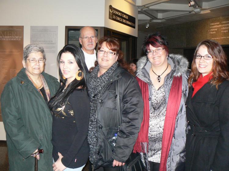 Diane Dubuc (centre) and her family enjoyed the Shen Yun Performing Arts closing show in Ottawa on Boxing Day. (Donna He/The Epoch Times)