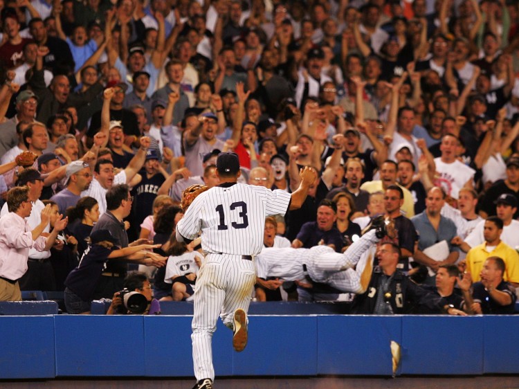 Derek Jeter dives into the stands after a foul ball against the Boston Red Sox. (Ezra Shaw/Getty Images)