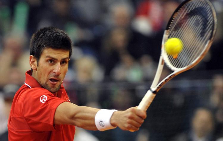 Serbia's Novak Djokovic stays focused against John Isner of the U.S. in Davis Cup first round action on Sunday. (ANDREJ ISAKOVIC/AFP/Getty Images)