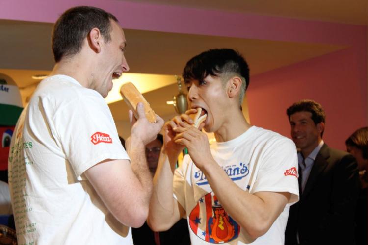 Rivals Joey Chestnut and Takeru Kobayashi go face-to-face at the weigh-in ceremony for Nathan's annual July 4 hot dog-eating contest on Conney Island. (Cliff Jia/Epoch Times)