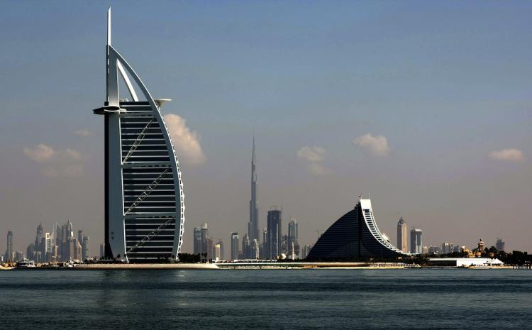 Dubai's three most prominent architectural icons, Burj an-Arab Hotel (L), Jumirah Hotel (R) and Burj Dubai (C), are seen along the coast of Dubai.  (Marwan Naamani/Getty Images )