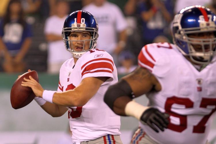 Giants quarterback Eli Manning is looking forward to starting this week against the Baltimore Ravens. (Nick Laham/Getty Images)