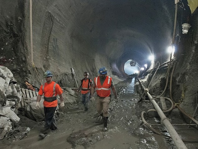 Workers walk through the East Side Access under Grand Central Station