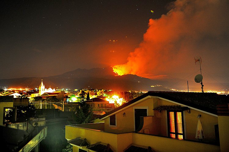 Lava spewed from a crater of the giant Mount Etna volcano