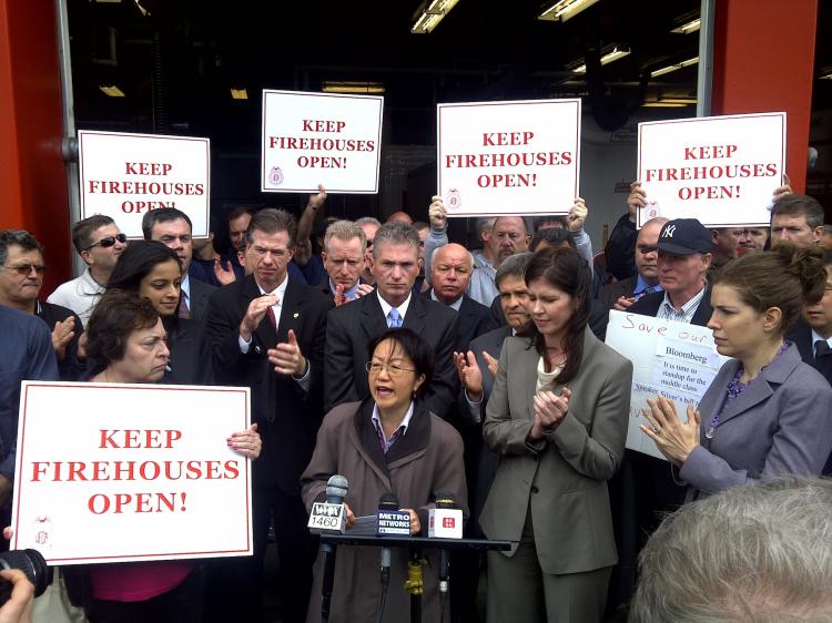 FIREHOUSE: (C to R) Councilwoman Margaret Chin, City Fire & Criminal Justice Committee Chairwoman Elizabeth Crowley, and Community Board 1 Chairwoman Julie Menin, were joined by (second row, C) Uniformed Firefighters Association President Stephen Cassidy and (second row, R) Uniformed Fire Officers Association President Al Hagan at a rally against firehouse closings at Engine 4 in Lower Manhattan on Wednesday.   (Courtesy of Kelly Magee)