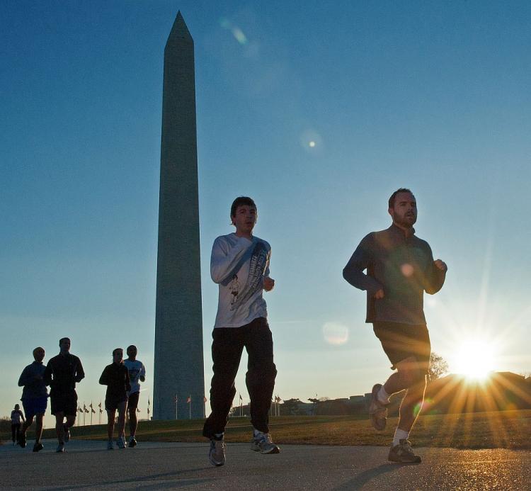 Early morning joggers run near the Washington Monument in November in Washington, DC. America's Health Rankings is an annual report meant to rank the states on health based on various criteria.  (Paul J. Richards/AFP/Getty Images)