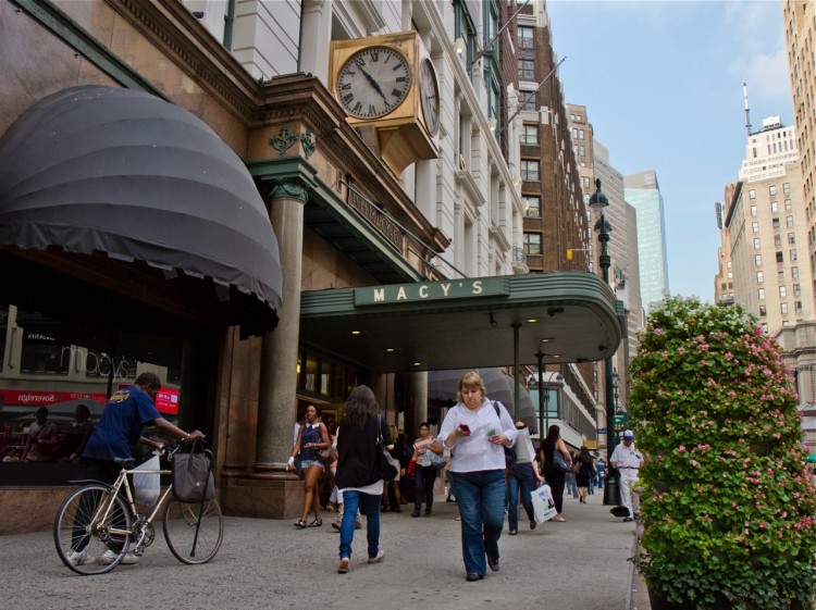 Shoppers are seen outside Macy's Herald Square on Sept. 26 in New York City. Department store chain Macy's Inc. announced that it would hire 78,000 seasonal workers for the 2011 holiday shopping rush, more than in past years. (Kristen Meriwether/The Epoch Times)