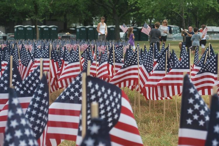 10,000 American flags were planted in the ground near the base of the Washington Monument spelling out the words 'Freedom From Oil.' (Ronny Dory/The Epoch Times )