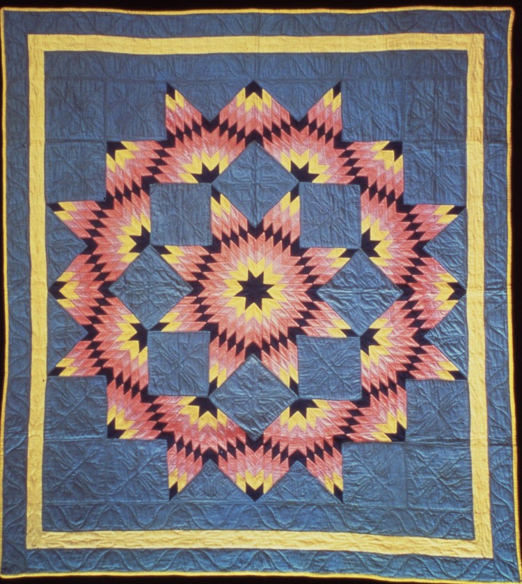 ANTIQUE QUILTS: The 'Broken Star Quilt' circa 1925 to 1935, by a Kansas woman, is part of an exhibit of hundreds of quilts at New York's American Folk Art Museum. (By Matt Hoebermann, courtesy of the American Folk Art Museu)
