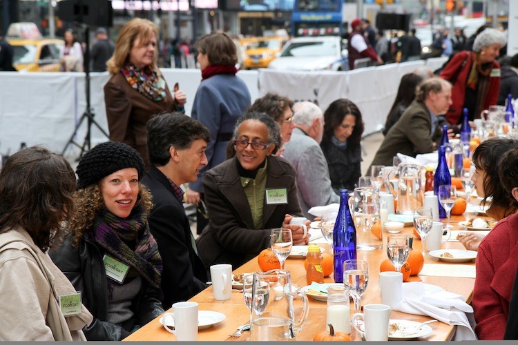 Food celebrities, farmers, and healthy eating advocates stand at the Times Square 'Eat Real, Eat-In,' part of the national Food Day on Monday. (Zack Stieber/The Epoch Times)