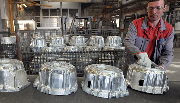 A man works on the manufacturing of automatic powertrains at the U.S. automaker General Motors' factory in Strasbourg, eastern France, on April 04. Many companies are moving production facilities abroad as the business climate in the U.S. declines. (FREDERICK FLORIN/AFP/Getty Images)