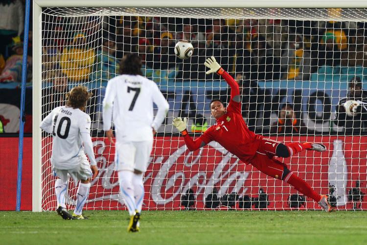 Uruguay's Diego Forlan scores on a penalty kick against South Africa in Pretoria on Wednesday. (Michael Steele/Getty Images)