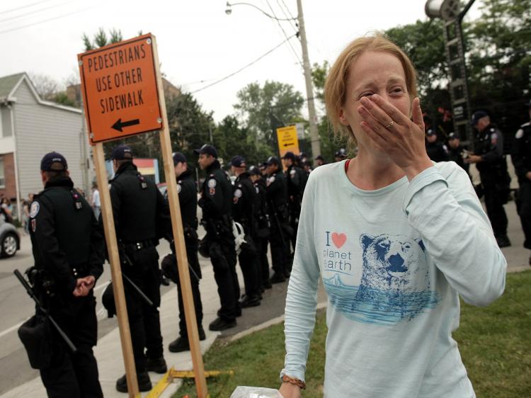 POLICE EXCESS: Selena Flood is overcome with emotion after she was released from the temporary G-20 detainment centre June 27, in Toronto, Canada. Hundreds of people, including journalists, were arrested by police in downtown Toronto during the G-20 Summi (Simon Hayter/Getty Images) POLICE EXCESS: Selena Flood is overcome with emotion after she was released from the temporary G-20 detainment centre June 27, in Toronto, Canada. Hundreds of people, including journalists, were arrested by police in downtown Toronto during the G-20 Summi (Simon Hayter/Getty Images)
