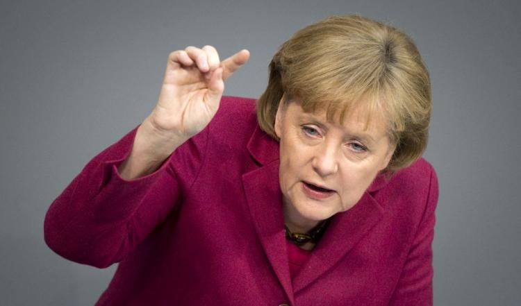 German Chancellor Angela Merkel delivers a speech during a debate about the budget at the Bundestag, on March 17, in Berlin. The 16-nation eurozone must have the option of removing one of its members from the club if a country persistently breaks its fiscal rules, German Chancellor Angela Merkel. (Michael Kappeler/AFP/Getty Images)