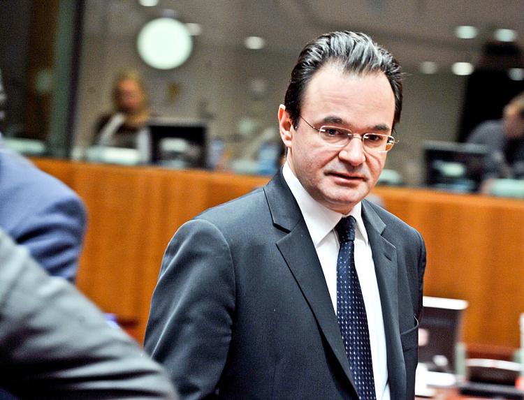 TROUBLED TIMES: Greek Finance Minister Giorgos Papaconstantinou arrives at a meeting with representatives of the eurozone nations on Feb. 16. at the EU headquarters in Brussels. Greece has been given until March 16 to show some effectiveness of its financial plan which aims to reduce the countries budget deficit.  (Georges Gobet/AFP/Getty Images)