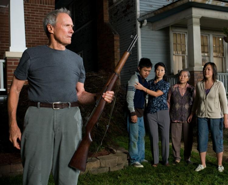 NEIGHBORS:(L-R) Walt Kowalski (Clint Eastwood), Thao (Bee Vang), Vu (Brooke Chia Thao), Grandma (Chee Thao) and Sue (Ahney Her) in a scene from the Clint Eastwood directed Gran Torino. (Anthony Michael Rivetti/Warner Bros. Pictures)