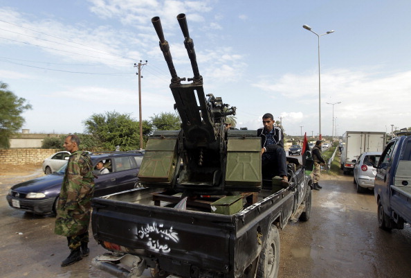 Fighters from the city of Misrata man a checkpoint on the road between Wershefana and Zawiyah cities at checkpoint 27 west of Tripoli. (Joseph Eid/AFP/Getty Images)