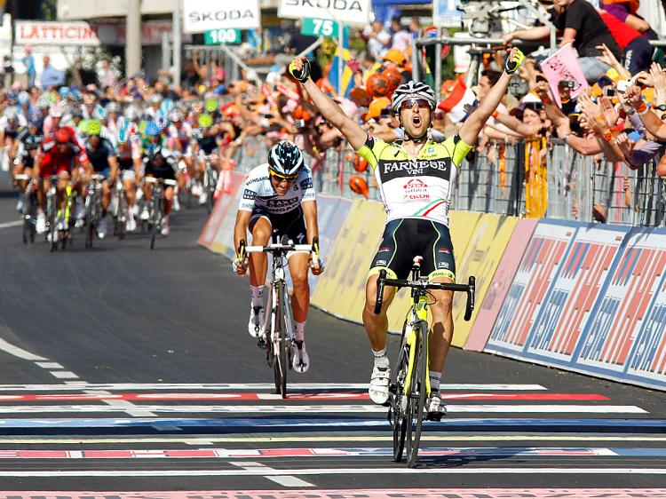 Oscar Gatto of Farnese-Neri crosses the finish line to win Stage Eight of the 2011 Giro d'Italia. (Luk Benies/AFP/Getty Images)