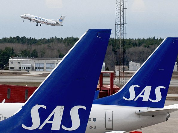 Scandinavian Airline Systems (SAS) airplanes at Arlanda airport, outside Stockholm, Sweden. SAS's recent ultimatum to its employees, a measure taken to prevent bankruptcy, departed drastically from usual business practices in Sweden.
